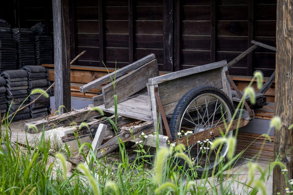 Old worn wooden wheelbarrow